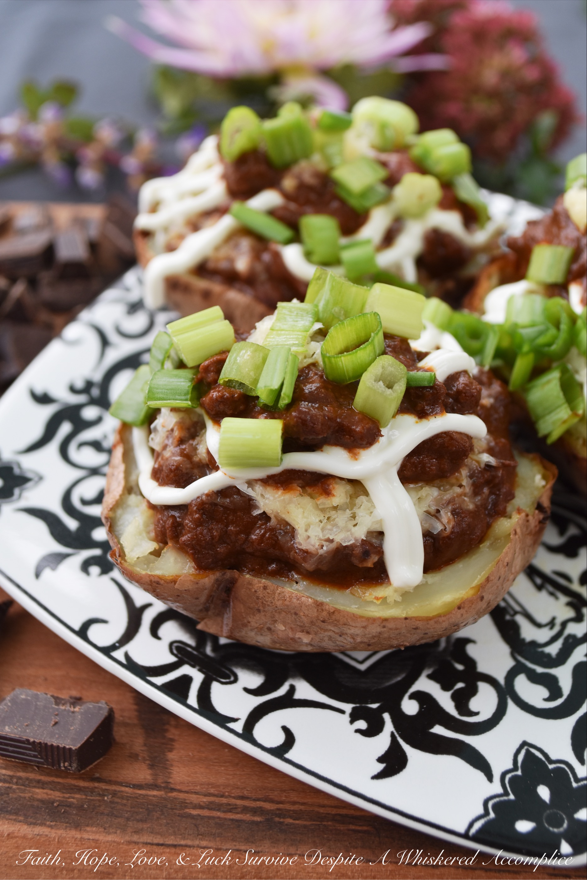 Secret Ingredient Beef Nacho Potato Skins - There's a secret ingredient used in these potato skins which helps make them taste absolutely amazing. Can you guess what it is? Chocolate. Adding a little bit of bittersweet baking chocolate to the nacho beef mixture stuffed inside of these oven-baked potato skins truly does make all the difference. Don't believe me? Give them a try and see for yourself.