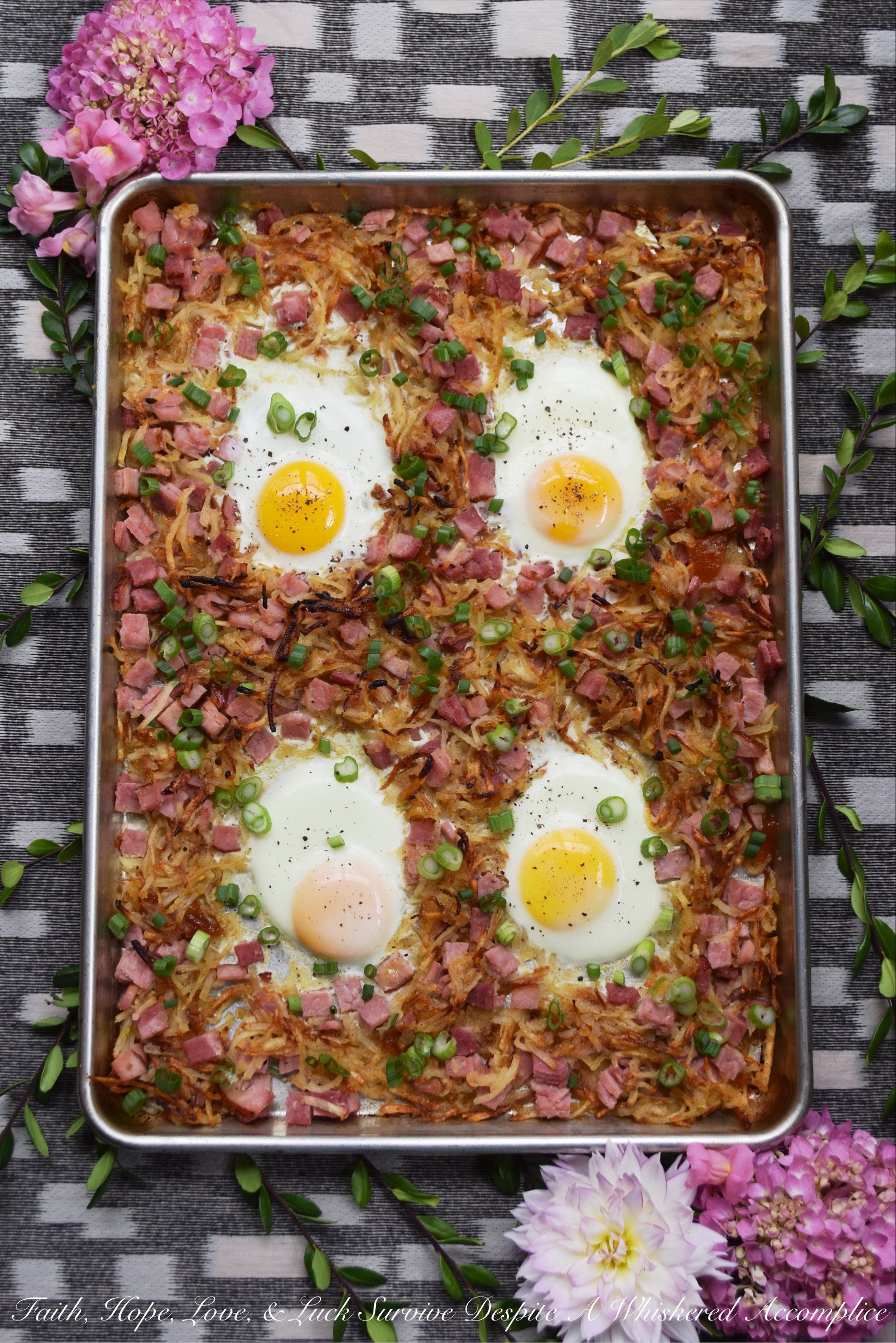 Southern Hash Browns & Ham Sheet Pan Bake - There's nothing more perfect for dinner on a busy weeknight than breakfast for dinner, especially when a sheet pan is used to make it. In this sheet pan bake, hash browns and ham are tossed with a special southern sauce made using apricot preserves, apple jelly, horseradish, and mustard. Add in a few eggs and some freshly chopped scallions, and dinner is served. Or breakfast if you prefer.