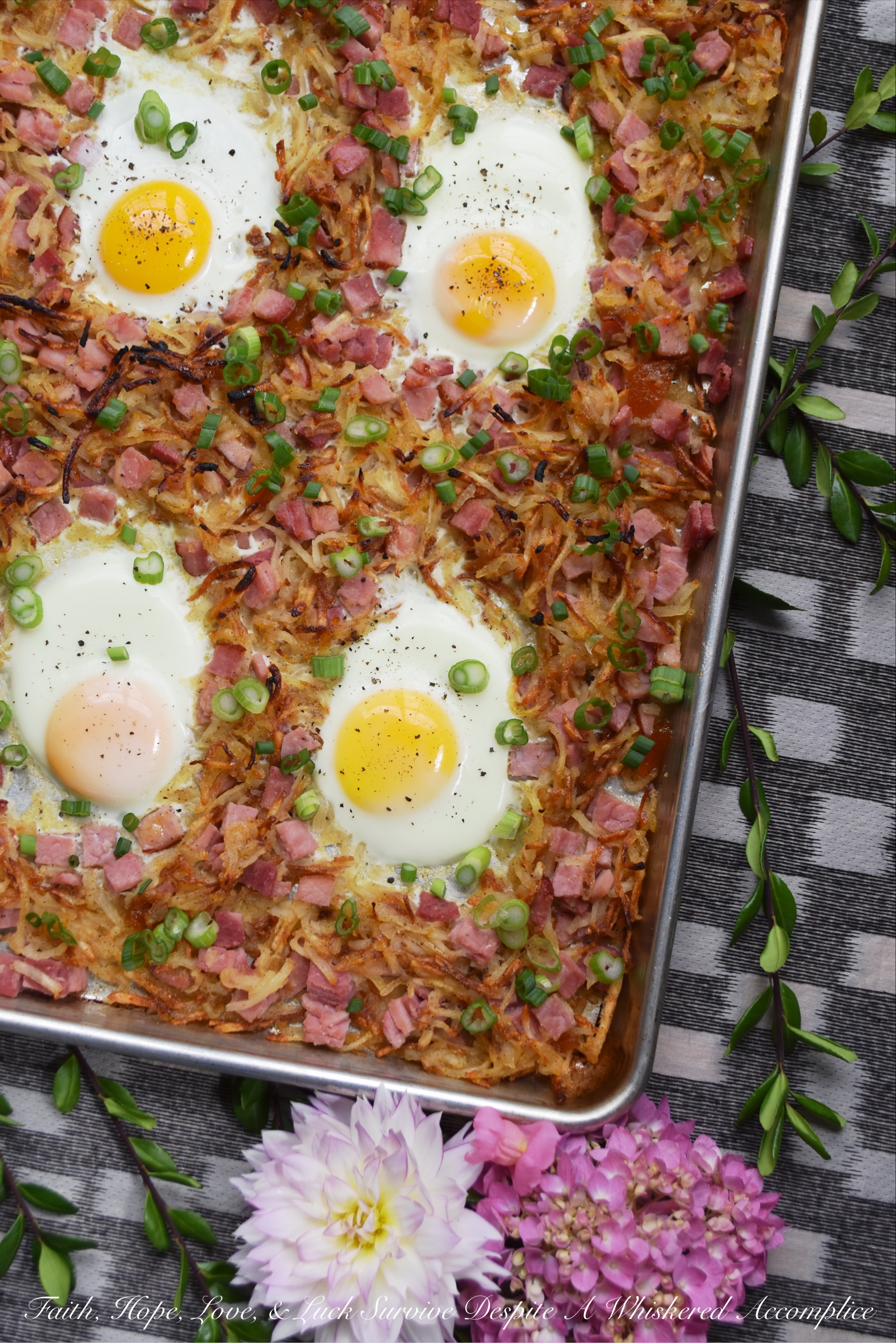 Southern Hash Browns & Ham Sheet Pan Bake - There's nothing more perfect for dinner on a busy weeknight than breakfast for dinner, especially when a sheet pan is used to make it. In this sheet pan bake, hash browns and ham are tossed with a special southern sauce made using apricot preserves, apple jelly, horseradish, and mustard. Add in a few eggs and some freshly chopped scallions, and dinner is served. Or breakfast if you prefer.
