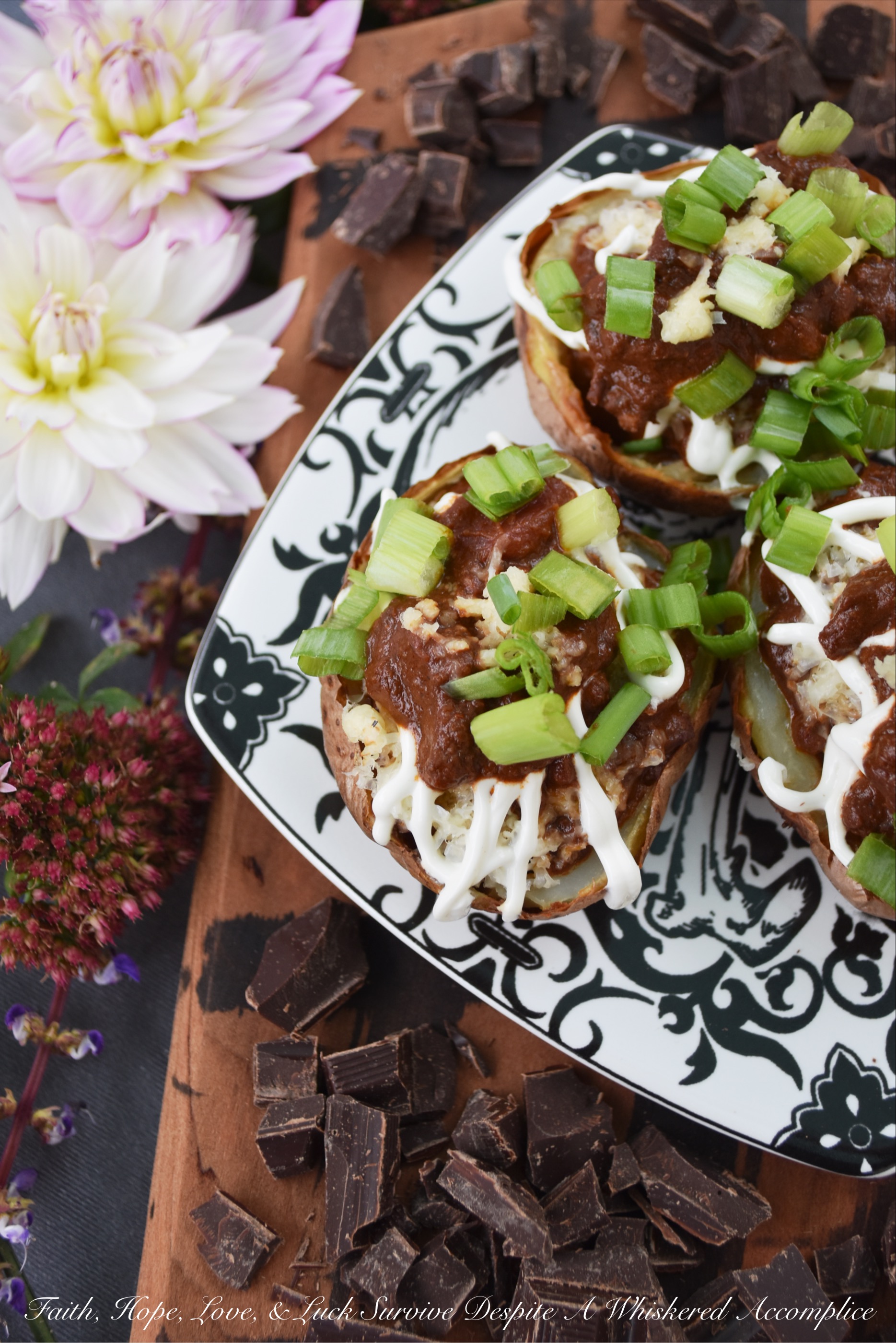 Secret Ingredient Beef Nacho Potato Skins - There's a secret ingredient used in these potato skins which helps make them taste absolutely amazing. Can you guess what it is? Chocolate. Adding a little bit of bittersweet baking chocolate to the nacho beef mixture stuffed inside of these oven-baked potato skins truly does make all the difference. Don't believe me? Give them a try and see for yourself.