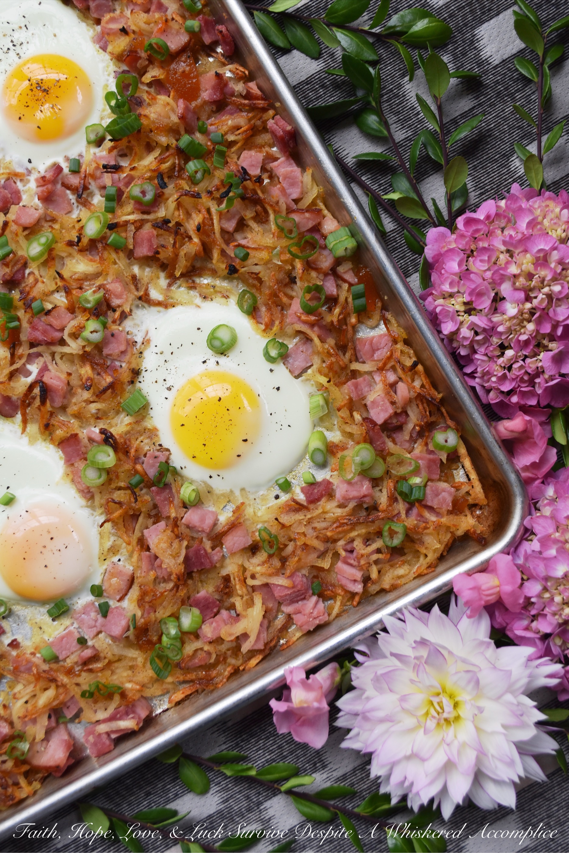 Southern Hash Browns & Ham Sheet Pan Bake - There's nothing more perfect for dinner on a busy weeknight than breakfast for dinner, especially when a sheet pan is used to make it. In this sheet pan bake, hash browns and ham are tossed with a special southern sauce made using apricot preserves, apple jelly, horseradish, and mustard. Add in a few eggs and some freshly chopped scallions, and dinner is served. Or breakfast if you prefer.