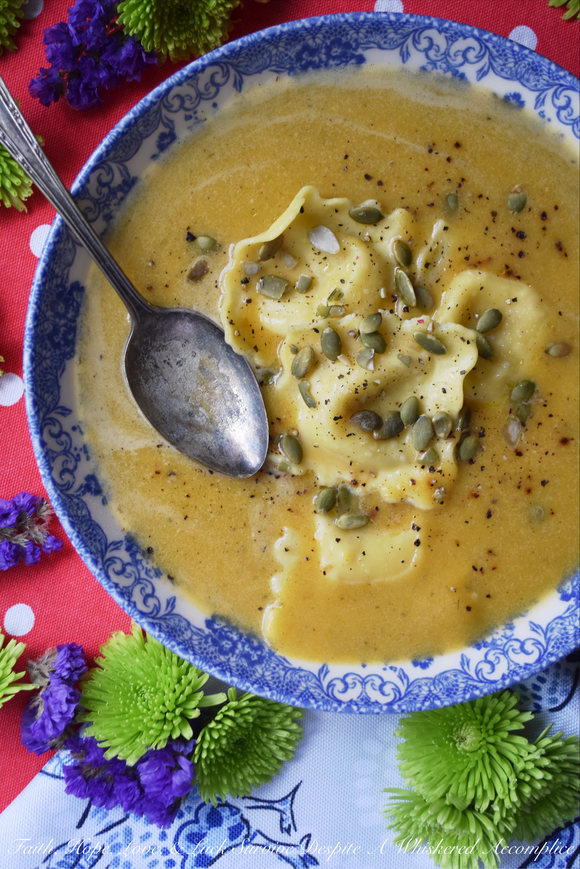 Butternut Squash Soup with Cheese Ravioli - There are days when you really want pasta for dinner but you're also craving a comforting bowl of soup as well. Why choose one over the other? This butternut squash soup with cheese ravioli makes it feasible to enjoy both, at the same time, in the most delicious way possible.