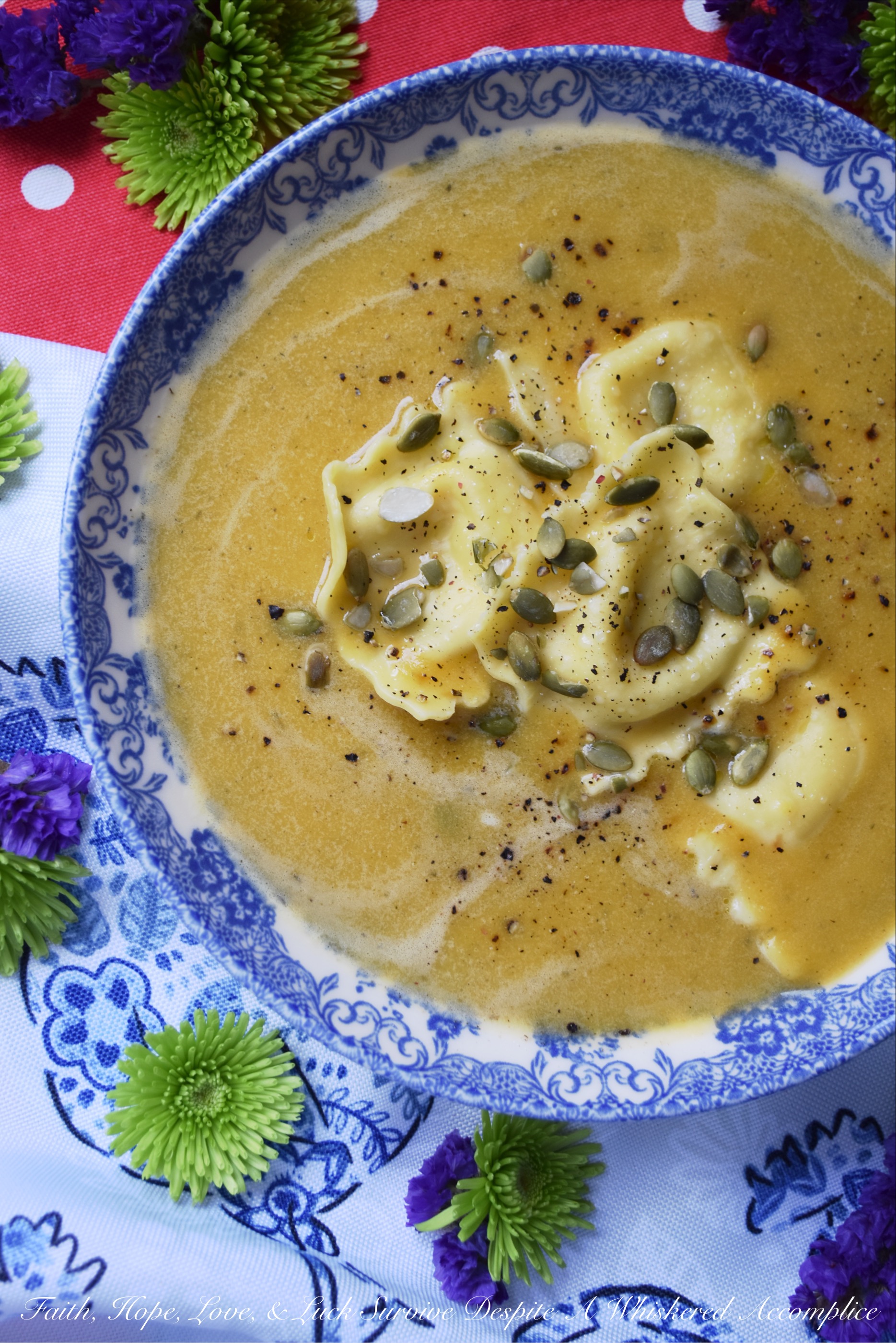 Butternut Squash Soup with Cheese Ravioli - There are days when you really want pasta for dinner but you're also craving a comforting bowl of soup as well. Why choose one over the other? This butternut squash soup with cheese ravioli makes it feasible to enjoy both, at the same time, in the most delicious way possible.