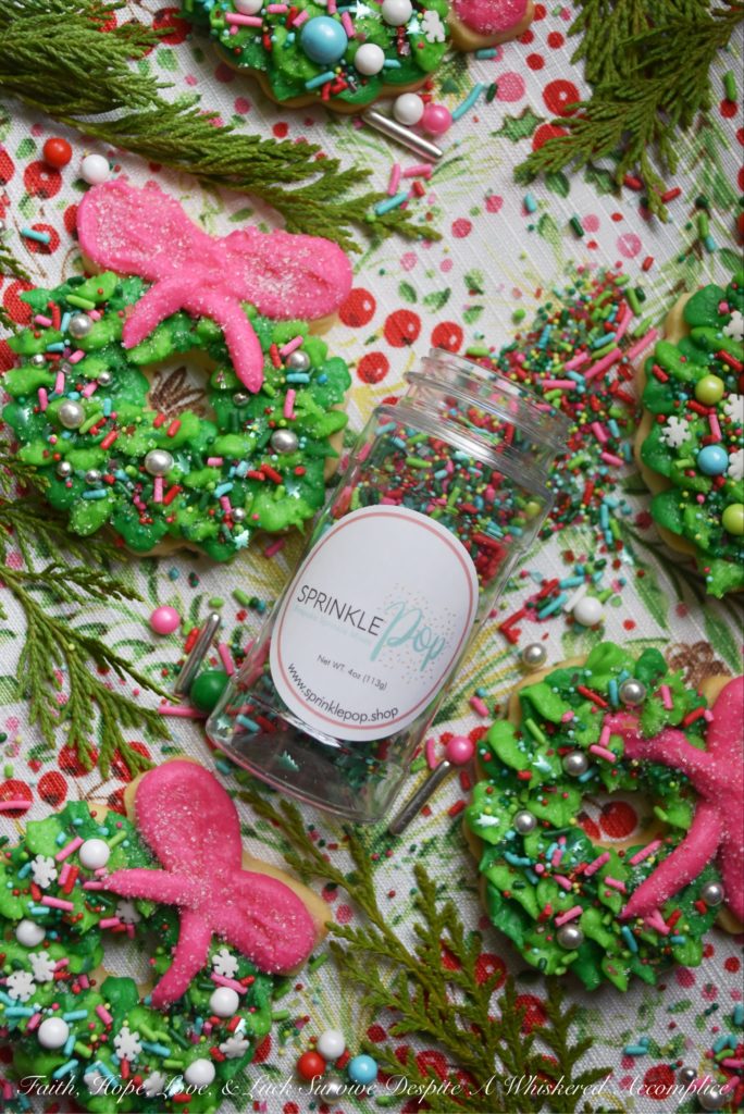 Whoville Christmas Wreath Sugar Cookies - All the little Whos in Whoville will simply adore these Whoville Christmas Wreath Sugar Cookies. To decorate these vivid green and pink buttercream icing frosted Christmas sugar cookies, simply break out your brightest and most whimsical sprinkles. When it comes to decorating these Christmas wreaths, there's no need to be a Grinch, don't hold back. In this case, more sprinkles is definitely a good thing.