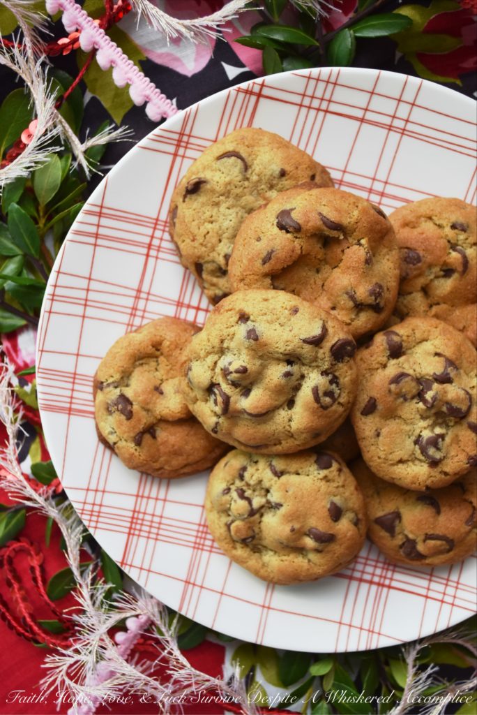 Chocolate Chip Vanilla Cookies - These simple and unassuming chocolate chip cookies are so much more than they first appear. They're soft and chewy, but also have an intense vanilla flavor that helps to bring out the taste of the semi-chocolate chips in them as well. In addition, they somehow manage to get even better after sitting for a few days after they are baked, which makes them the perfect Christmas cookie to add to a holiday cookie tray.