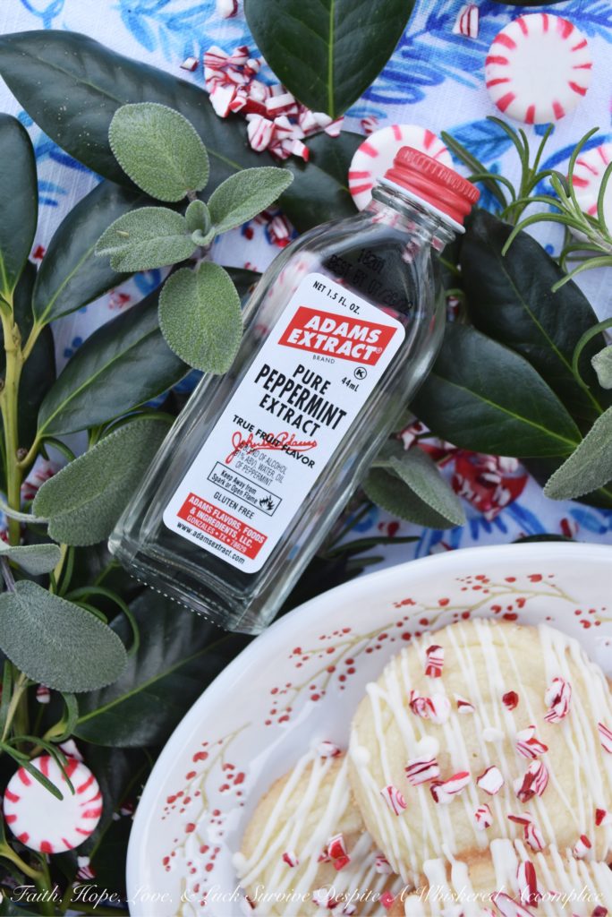 White Christmas Peppermint Holiday Cookies - Not only do these peppermint holiday cookies practically melt in your mouth, but due to their flaky texture, they almost crumble apart at the gentlest touch. Thankfully the white chocolate they are drizzled with helps keep them together just long enough for you to get them from your hand to your mouth. Sure there may be a few crumbs dropped during the process, but who can't live with a few crumbs at Christmas time?