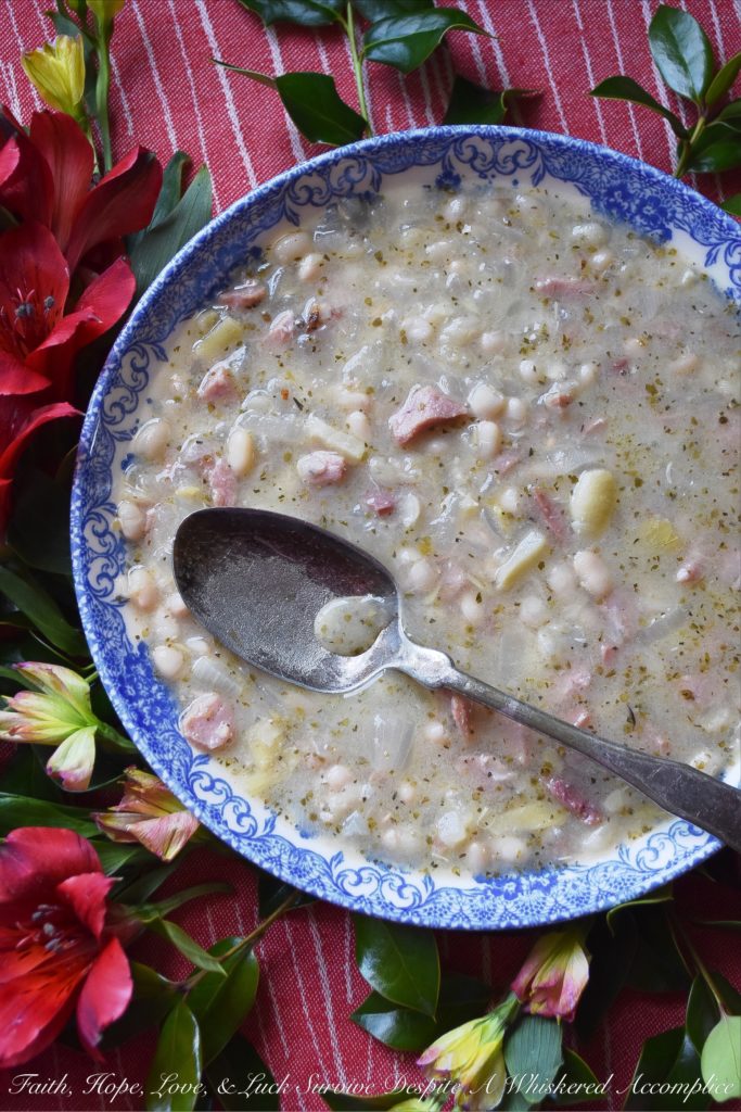 Italian Asiago Artichoke Ham & Bean Soup - Winter soups are great to make when you're starting to get the mid-winter blahs. Not only do they help raise the temperature in the kitchen, but they also help cheer you up with their comforting warmth and aroma. This particular winter soup uses dried beans, ham, jarred marinated artichoke hearts, and grated Asiago cheese, along with several other Italian herbs and spices. It's total comfort food.
