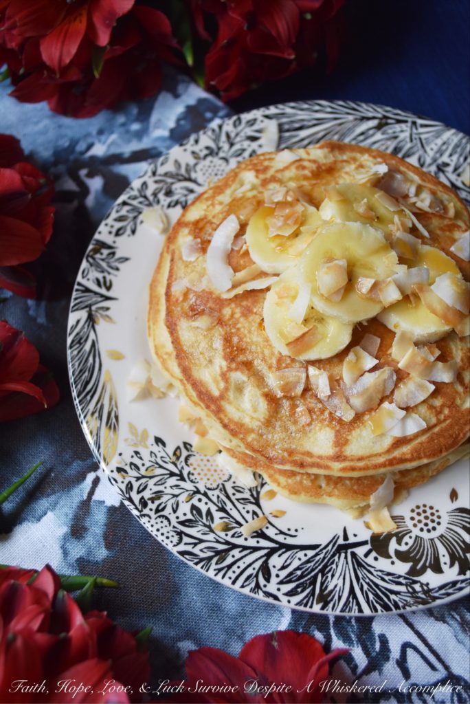 Coconut & Banana Oat Pancakes - Ground coconut and oatmeal give these banana pancakes a lovely texture and an even more amazing taste. Add a little bit of toasted coconut on top with some sliced bananas and pure maple syrup, and you've got a breakfast that will make you happy to roll out of bed in the morning.