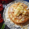 Coconut & Banana Oat Pancakes - Ground coconut and oatmeal give these banana pancakes a lovely texture and an even more amazing taste. Add a little bit of toasted coconut on top with some sliced bananas and pure maple syrup, and you've got a breakfast that will make you happy to roll out of bed in the morning.