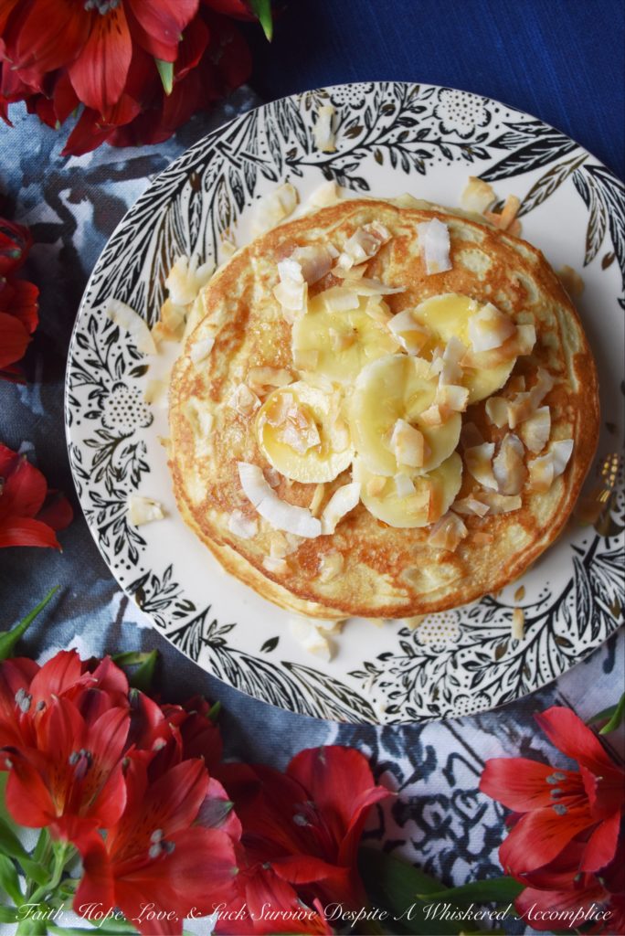 Coconut & Banana Oat Pancakes - Ground coconut and oatmeal give these banana pancakes a lovely texture and an even more amazing taste. Add a little bit of toasted coconut on top with some sliced bananas and pure maple syrup, and you've got a breakfast that will make you happy to roll out of bed in the morning.