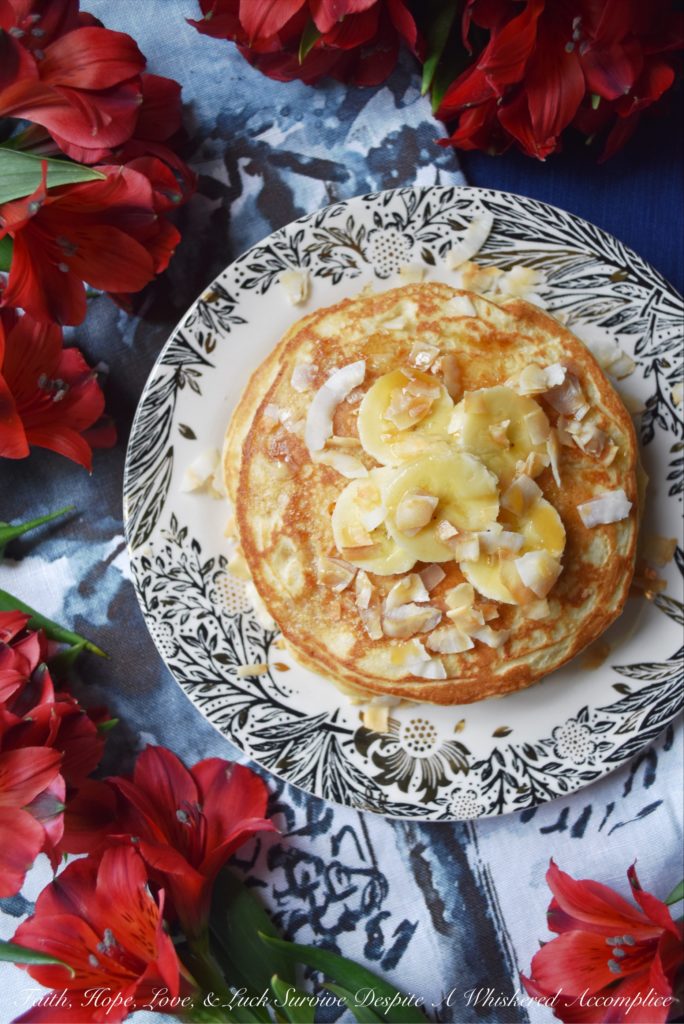 Coconut & Banana Oat Pancakes - Ground coconut and oatmeal give these banana pancakes a lovely texture and an even more amazing taste. Add a little bit of toasted coconut on top with some sliced bananas and pure maple syrup, and you've got a breakfast that will make you happy to roll out of bed in the morning.