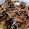 Sweet Tea Pork Piccata - Thin seasoned and flour-dredged pork chops are quickly sautéed over medium-high heat to absolute golden perfection. Then, the same pan is used to make a fast and absolutely amazing piccata pan sauce using sweet tea vodka, lemon juice, and capers. Not only is this is an easy and quick weeknight dish, but it's also lovely to serve alongside a salad, pasta, rice, potatoes, or even vegetables.