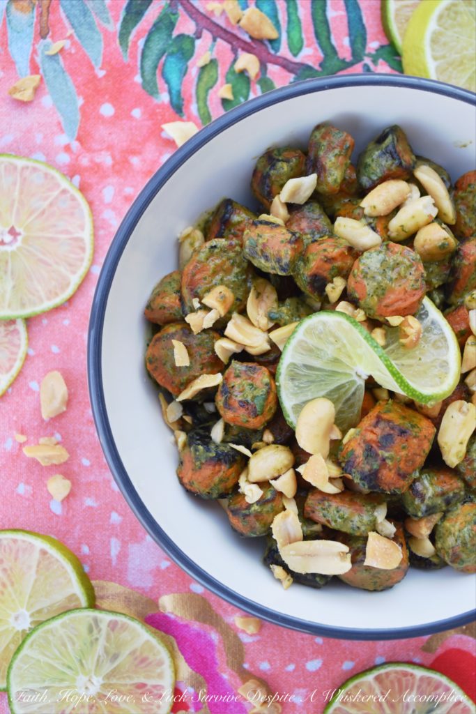 Vegan Thai Roasted Carrots with Peanuts - Transform basic roasted carrots into a truly extraordinary vegan side dish with a simple Thai sauce made using fresh cilantro, lime juice, peanut butter, salt, and crushed red pepper flakes. Add a few roughly chopped salted roasted peanuts before serving, and you'll have a flavorful healthy vegetable dish your entire family will ask for again and again. #Veganuary #Vegan #HealthyRecipe