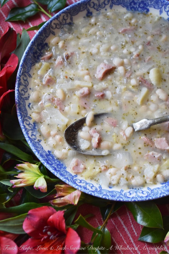 Italian Asiago Artichoke Ham & Bean Soup - Winter soups are great to make when you're starting to get the mid-winter blahs. Not only do they help raise the temperature in the kitchen, but they also help cheer you up with their comforting warmth and aroma. This particular winter soup uses dried beans, ham, jarred marinated artichoke hearts, and grated Asiago cheese, along with several other Italian herbs and spices. It's total comfort food.