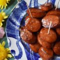 Soda Glazed Kielbasa Game Day Bites - These sweet and spicy soda glazed Polish kielbasa appetizers are made using one pan, take less than 20 minutes to make, and are sure to be a huge hit at your next football party. Soda, brown sugar, cayenne pepper, and a few other seasonings give these little game day bites a real flavor kick that your guests will absolutely love. Now, if only the Super Bowl commercials are half as good, we'll really have something to celebrate.