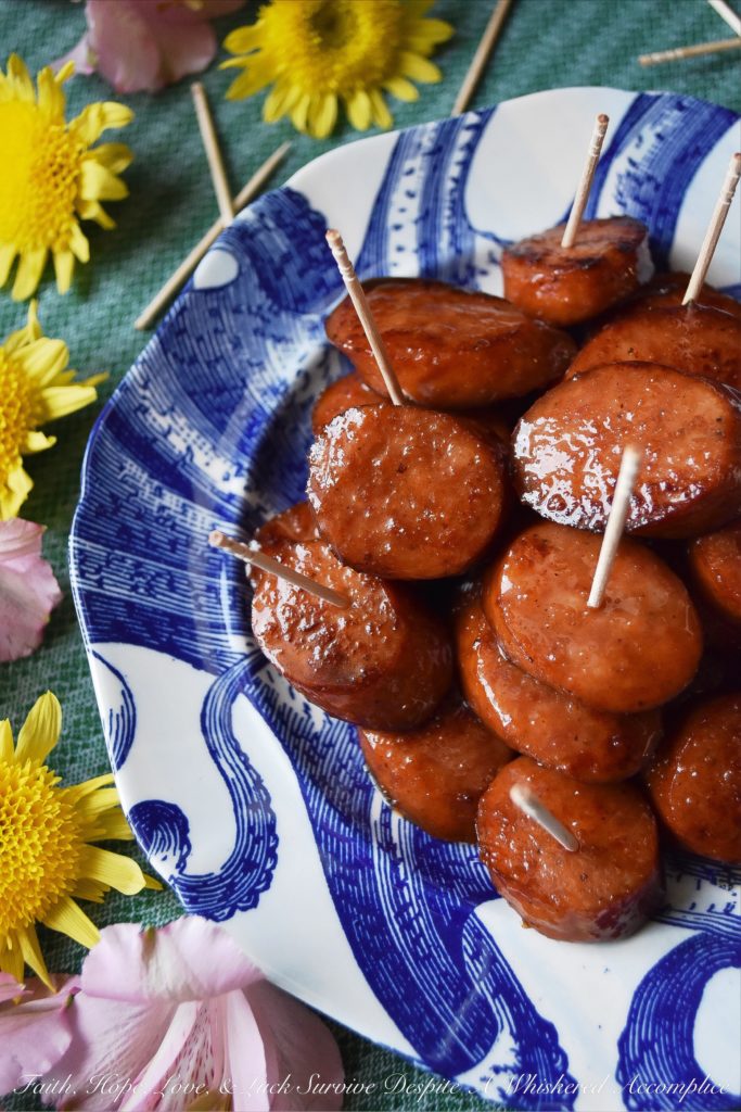 Soda Glazed Kielbasa Game Day Bites - These sweet and spicy soda glazed Polish kielbasa appetizers are made using one pan, take less than 20 minutes to make, and are sure to be a huge hit at your next football party. Soda, brown sugar, cayenne pepper, and a few other seasonings give these little game day bites a real flavor kick that your guests will absolutely love. Now, if only the Super Bowl commercials are half as good, we'll really have something to celebrate.