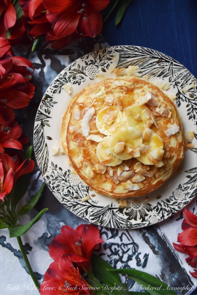 Coconut & Banana Oat Pancakes - Ground coconut and oatmeal give these banana pancakes a lovely texture and an even more amazing taste. Add a little bit of toasted coconut on top with some sliced bananas and pure maple syrup, and you've got a breakfast that will make you happy to roll out of bed in the morning.