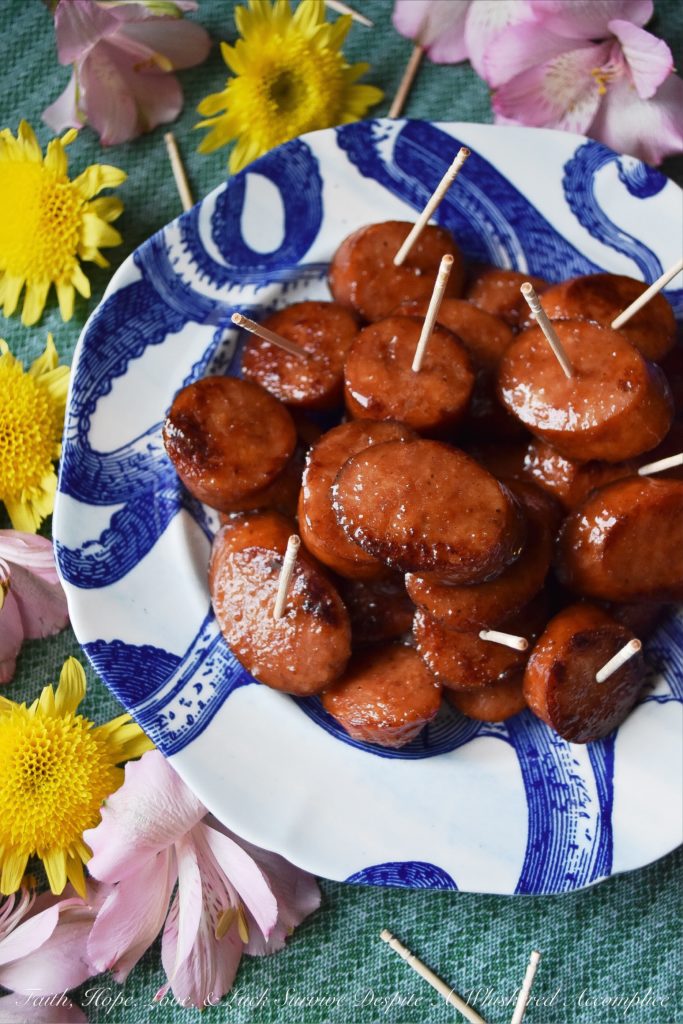 Soda Glazed Kielbasa Game Day Bites - These sweet and spicy soda glazed Polish kielbasa appetizers are made using one pan, take less than 20 minutes to make, and are sure to be a huge hit at your next football party. Soda, brown sugar, cayenne pepper, and a few other seasonings give these little game day bites a real flavor kick that your guests will absolutely love. Now, if only the Super Bowl commercials are half as good, we'll really have something to celebrate.