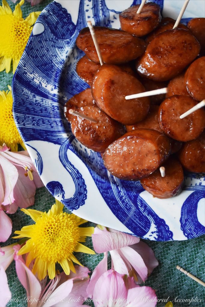 Soda Glazed Kielbasa Game Day Bites - These sweet and spicy soda glazed Polish kielbasa appetizers are made using one pan, take less than 20 minutes to make, and are sure to be a huge hit at your next football party. Soda, brown sugar, cayenne pepper, and a few other seasonings give these little game day bites a real flavor kick that your guests will absolutely love. Now, if only the Super Bowl commercials are half as good, we'll really have something to celebrate.