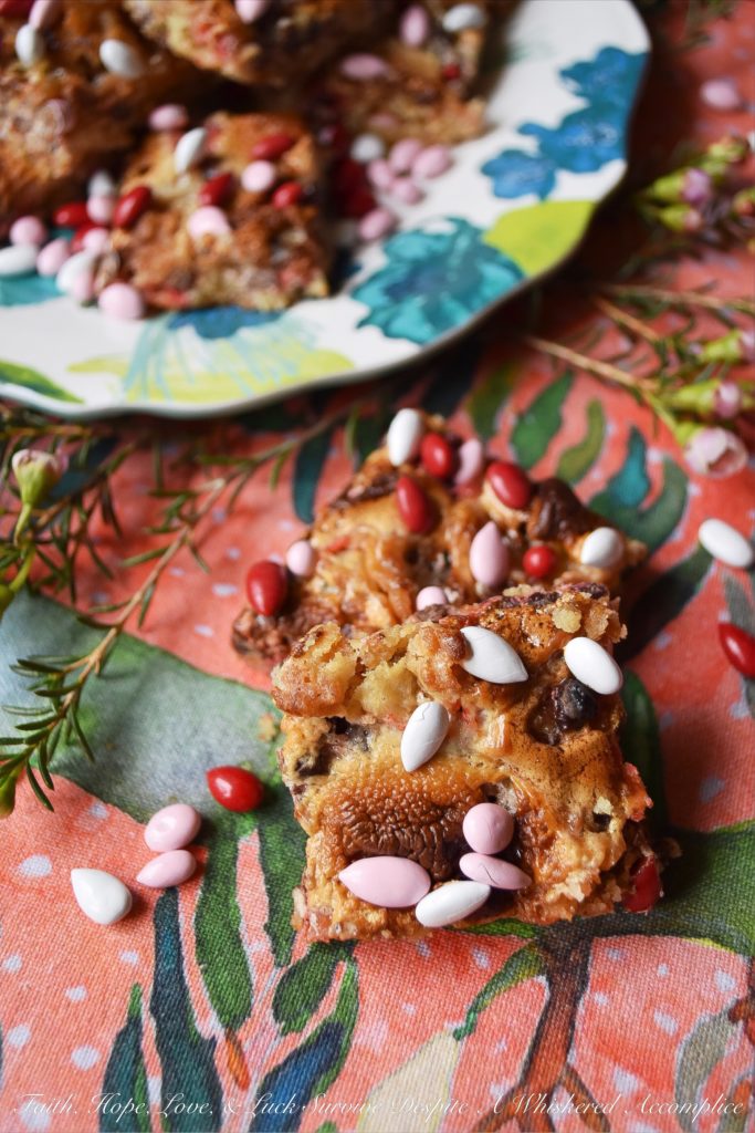 Chocolate Covered Sunflower Seed Krispies Bars - These absolutely amazing sweet, chewy, and crispy cookie bars are half s'mores bar and half rice krispies treat. Basically, they are pretty much the best of both worlds. Add in the fact that they are both filled and topped with chocolate covered sunflower seeds, and what's not to totally fall in love with?