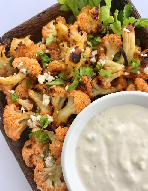 Roasted Buffalo Cauliflower with Blue Cheese Dressing - Savory Moments - Welcome to Friday! Friday! Friday! Favorites! Each Friday we'll be sharing our favorite recipes of the week from other fabulous food bloggers, so make sure to visit and see what tasty over-the-top dishes we're most excited about.