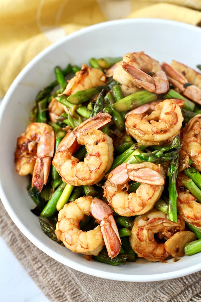 Shrimp and Asparagus Stir-Fry - Karen's Kitchen Stories - Welcome to Friday! Friday! Friday! Favorites! Each Friday we'll be sharing our favorite recipes of the week from other fabulous food bloggers, so make sure to visit and see what tasty over-the-top dishes we're most excited about.