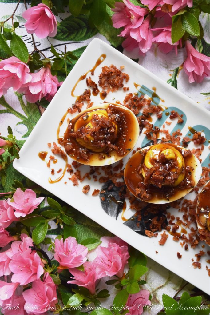 Deviled Eggs with Bacon & Bourbon Glaze - Unlike most deviled egg recipes, this one calls for 15 hard-boiled eggs instead of 12. You'll have 24 deviled eggs to serve at your cookout, picnic, or party, and 6 to sample and taste-test beforehand. No more sneaking a deviled egg, thus leaving an empty space in your egg tray. And, with tons of bacon and a homemade bourbon glaze, these are deviled eggs you're definitely going to want to sample.