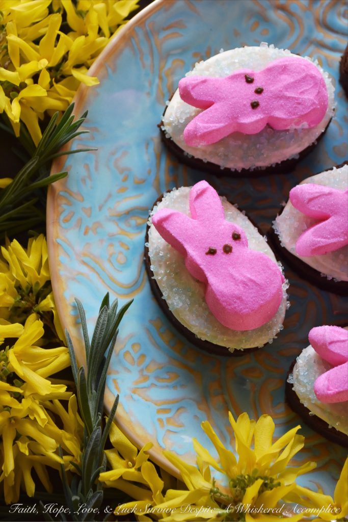 Chocolate Stout Frosted Brownies with PEEPS - Combine two holidays into one sweet festive treat with these Chocolate Stout Frosted Brownies with PEEPS. Use leftover St. Patrick's Day stout to make fudgy chocolate brownies, frost them with a simple cream cheese frosting, and then sprinkle them with colored sugar and garnish with sugary Easter PEEPS Marshmallow Bunnies. A perfect spring dessert that is sure to put a smile on your face.