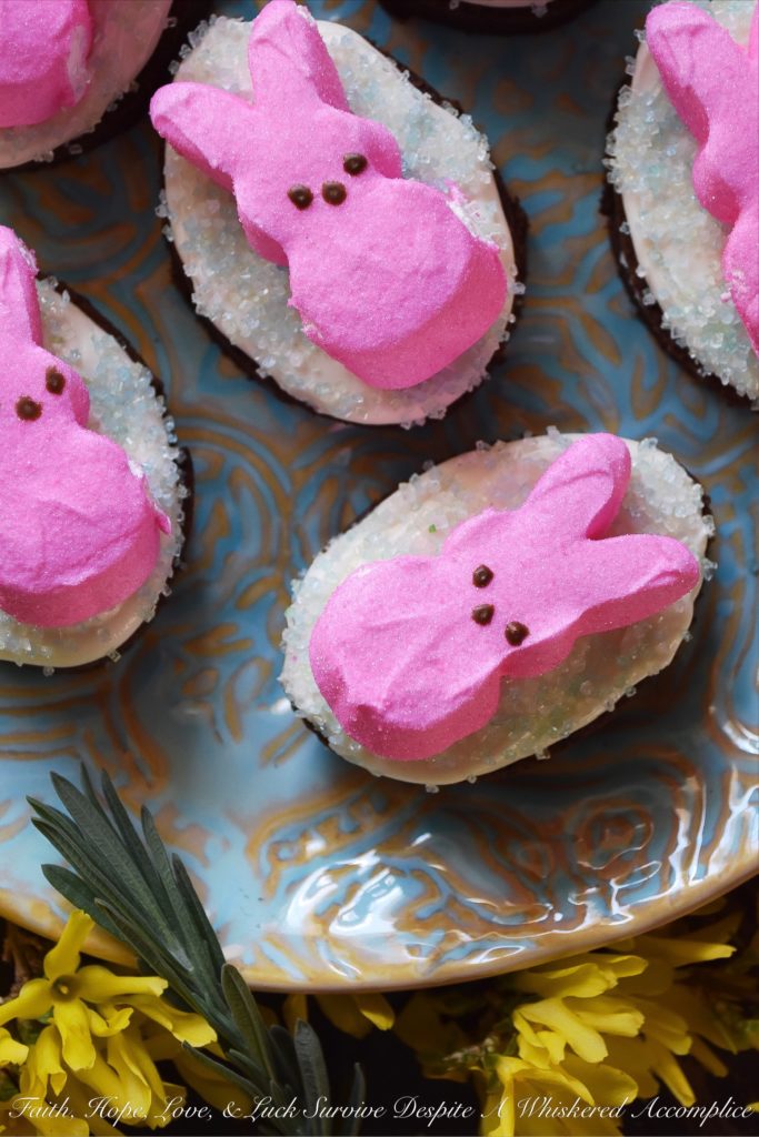 Chocolate Stout Frosted Brownies with PEEPS - Combine two holidays into one sweet festive treat with these Chocolate Stout Frosted Brownies with PEEPS. Use leftover St. Patrick's Day stout to make fudgy chocolate brownies, frost them with a simple cream cheese frosting, and then sprinkle them with colored sugar and garnish with sugary Easter PEEPS Marshmallow Bunnies. A perfect spring dessert that is sure to put a smile on your face.