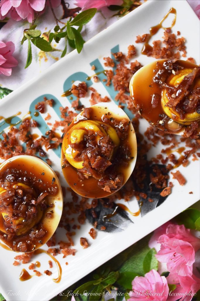 Deviled Eggs with Bacon & Bourbon Glaze - Unlike most deviled egg recipes, this one calls for 15 hard-boiled eggs instead of 12. You'll have 24 deviled eggs to serve at your cookout, picnic, or party, and 6 to sample and taste-test beforehand. No more sneaking a deviled egg, thus leaving an empty space in your egg tray. And, with tons of bacon and a homemade bourbon glaze, these are deviled eggs you're definitely going to want to sample.