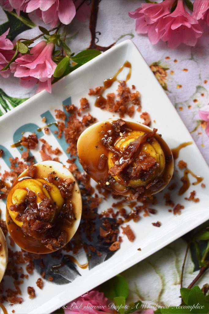 Deviled Eggs with Bacon & Bourbon Glaze - Unlike most deviled egg recipes, this one calls for 15 hard-boiled eggs instead of 12. You'll have 24 deviled eggs to serve at your cookout, picnic, or party, and 6 to sample and taste-test beforehand. No more sneaking a deviled egg, thus leaving an empty space in your egg tray. And, with tons of bacon and a homemade bourbon glaze, these are deviled eggs you're definitely going to want to sample.