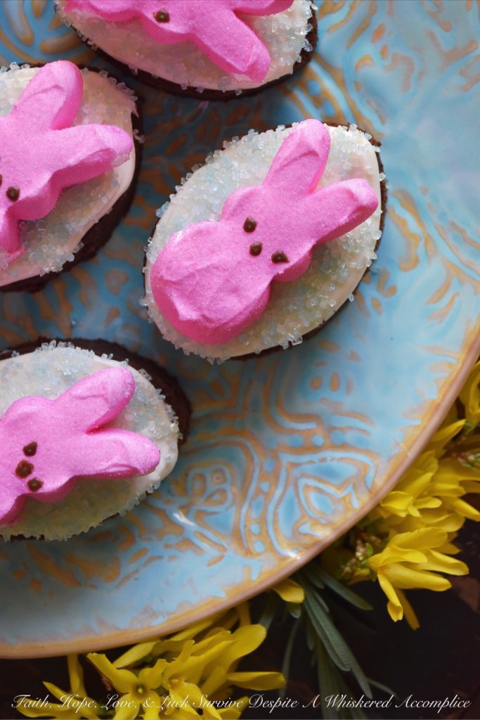 Chocolate Stout Frosted Brownies with PEEPS - Combine two holidays into one sweet festive treat with these Chocolate Stout Frosted Brownies with PEEPS. Use leftover St. Patrick's Day stout to make fudgy chocolate brownies, frost them with a simple cream cheese frosting, and then sprinkle them with colored sugar and garnish with sugary Easter PEEPS Marshmallow Bunnies. A perfect spring dessert that is sure to put a smile on your face.