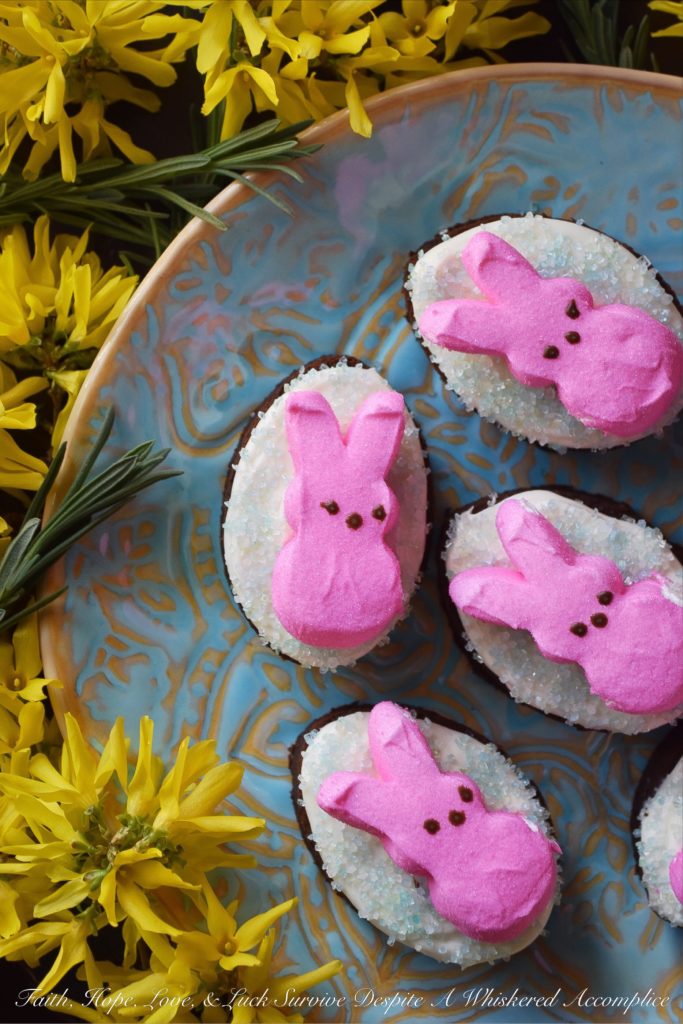 Chocolate Stout Frosted Brownies with PEEPS - Combine two holidays into one sweet festive treat with these Chocolate Stout Frosted Brownies with PEEPS. Use leftover St. Patrick's Day stout to make fudgy chocolate brownies, frost them with a simple cream cheese frosting, and then sprinkle them with colored sugar and garnish with sugary Easter PEEPS Marshmallow Bunnies. A perfect spring dessert that is sure to put a smile on your face.