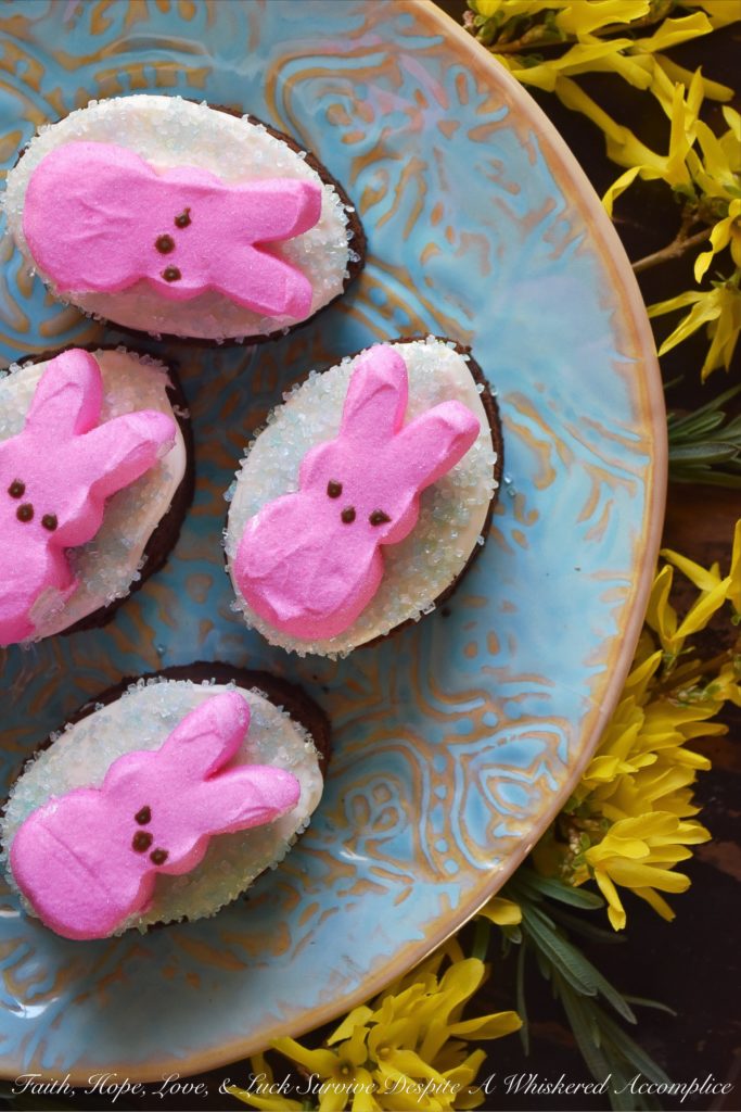 Chocolate Stout Frosted Brownies with PEEPS - Combine two holidays into one sweet festive treat with these Chocolate Stout Frosted Brownies with PEEPS. Use leftover St. Patrick's Day stout to make fudgy chocolate brownies, frost them with a simple cream cheese frosting, and then sprinkle them with colored sugar and garnish with sugary Easter PEEPS Marshmallow Bunnies. A perfect spring dessert that is sure to put a smile on your face.