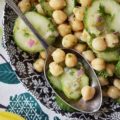 Tangy Chickpea & English Cucumber Salad - Canned chickpeas are transformed into a healthy and flavorful side salad with the addition of thinly sliced English cucumbers, finely diced red onions, as well as both fresh and dried herbs and seasonings. This healthy tangy lemon chickpea salad will soon become a family favorite recipe you won't have to feel the least bit guilty about.