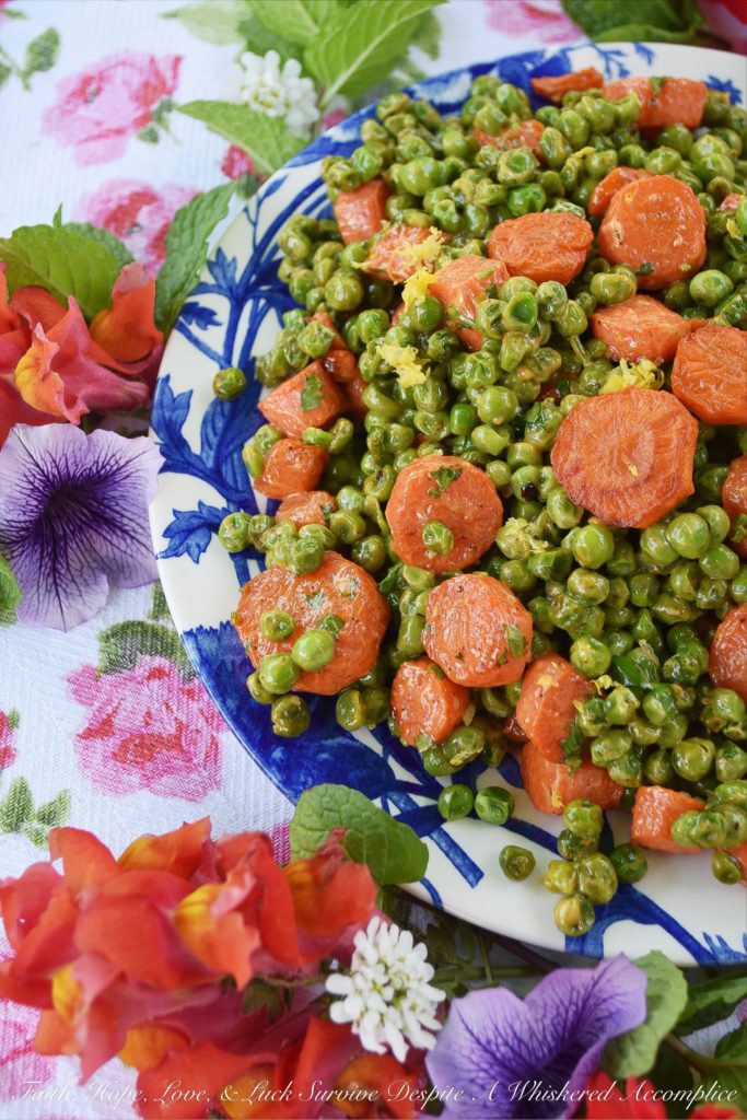 Warm Roasted Carrot & Pea Chipotle Salad - Not only is this warm roasted carrot and pea side salad colorful and full of flavor, but it's also the perfect vegetable salad to serve with almost any type of grilled meat or fish. The tiny bit of mayonnaise it contains gives it just the right amount of richness, and the lemon zest and chipotle lend a refreshing kick to the peas and carrots.