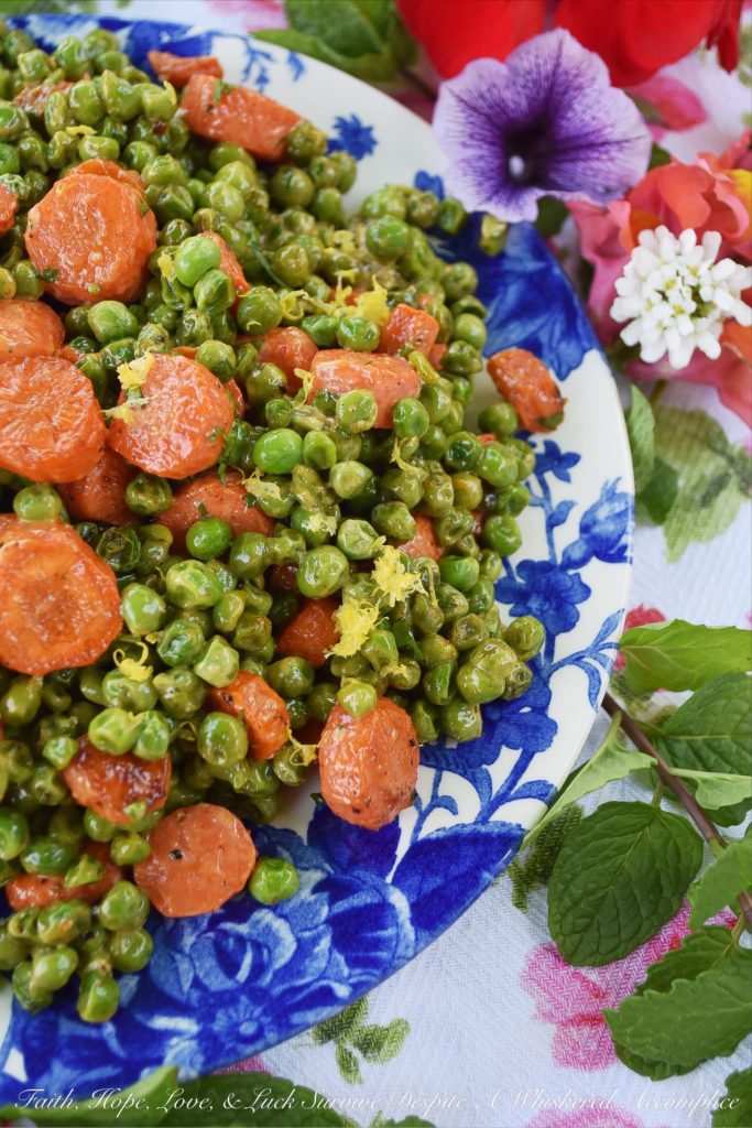 Warm Roasted Carrot & Pea Chipotle Salad - Not only is this warm roasted carrot and pea side salad colorful and full of flavor, but it's also the perfect vegetable salad to serve with almost any type of grilled meat or fish. The tiny bit of mayonnaise it contains gives it just the right amount of richness, and the lemon zest and chipotle lend a refreshing kick to the peas and carrots.