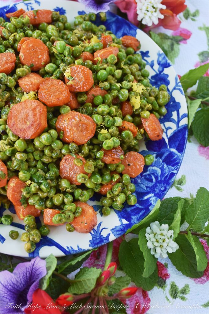 Warm Roasted Carrot & Pea Chipotle Salad - Not only is this warm roasted carrot and pea side salad colorful and full of flavor, but it's also the perfect vegetable salad to serve with almost any type of grilled meat or fish. The tiny bit of mayonnaise it contains gives it just the right amount of richness, and the lemon zest and chipotle lend a refreshing kick to the peas and carrots.