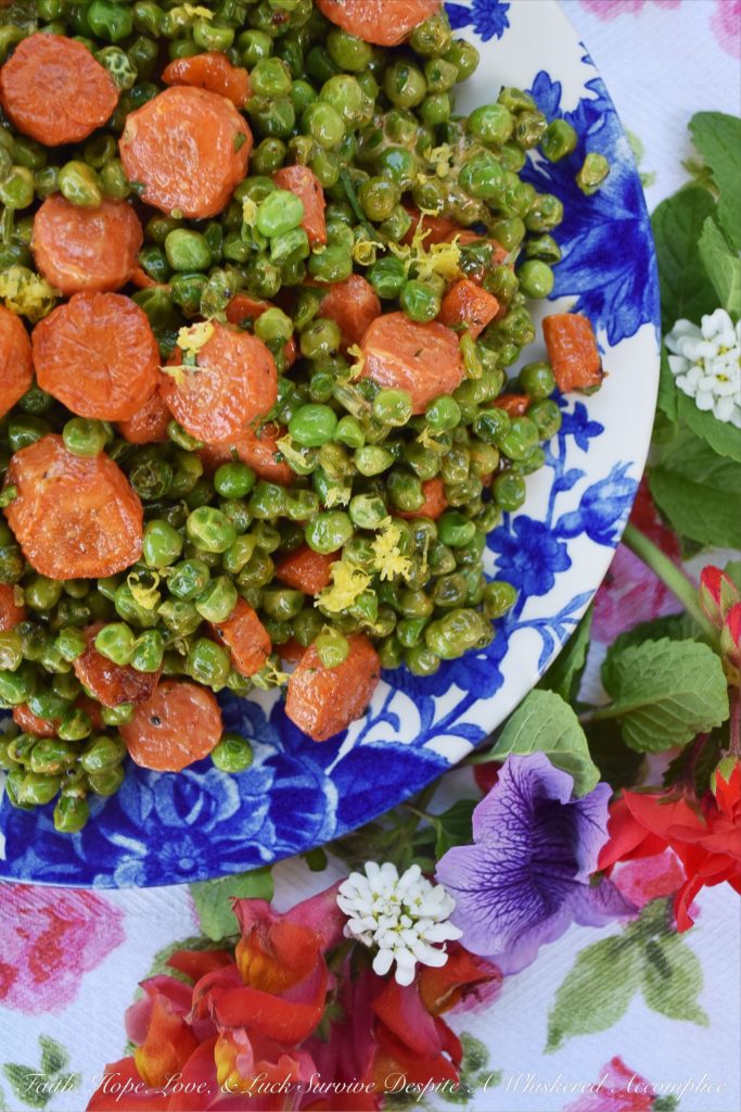 Warm Roasted Carrot & Pea Chipotle Salad - Not only is this warm roasted carrot and pea side salad colorful and full of flavor, but it's also the perfect vegetable salad to serve with almost any type of grilled meat or fish. The tiny bit of mayonnaise it contains gives it just the right amount of richness, and the lemon zest and chipotle lend a refreshing kick to the peas and carrots.