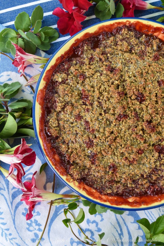 Strawberry Crisp with Pepita & Chia Seed Topping - It's often hard to achieve a truly crispy topping when baking a strawberry crisp if you aren't using nuts in the topping. This sweet summer strawberry crisp uses pepita and chia seeds to create the perfect crispy topping, for those who are allergic to nuts, who still crave a delicious crispy crunchy baked summer berry dessert.
