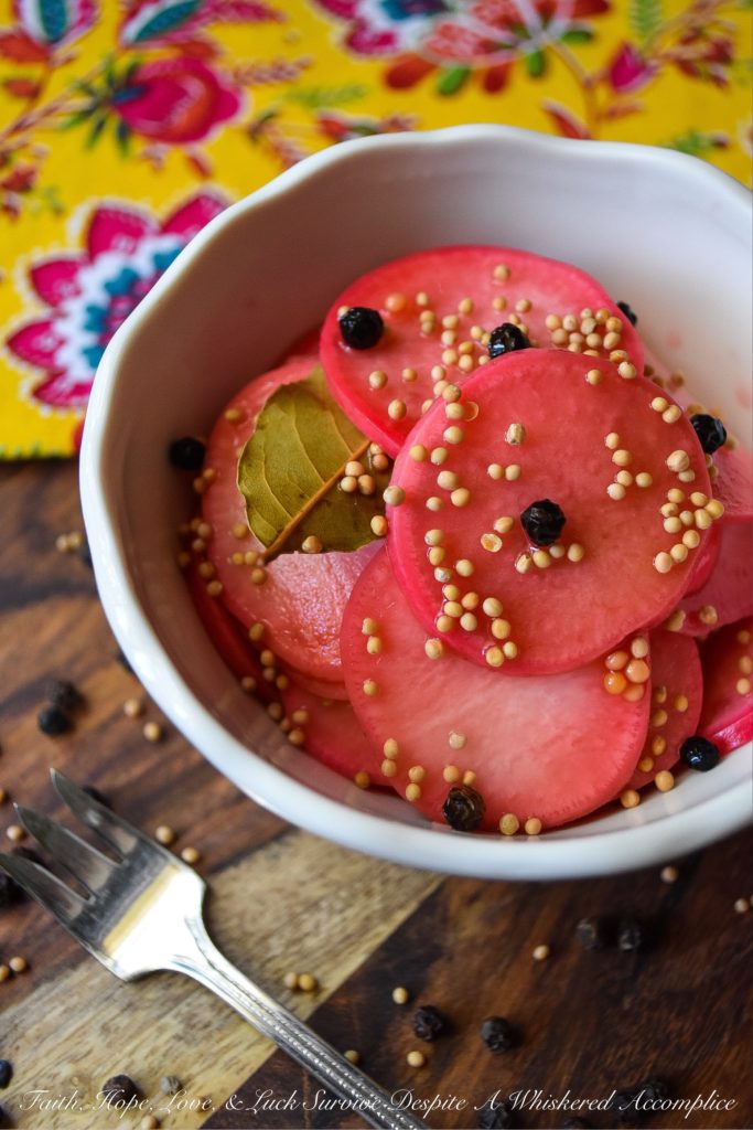 Quick Pickled Radishes with Black Peppercorns - These quick pickled radishes with black peppercorns are the perfect addition to tacos, barbecue, or just about any sandwich you can dream of. Each sliced radish is just a little bit sweet, slightly crunchy, and has an amazing amount of zing, which really works well when paired with other foods. The best part is, you can make these in almost no time at all. You're probably going to want to have a batch in your fridge at all times.