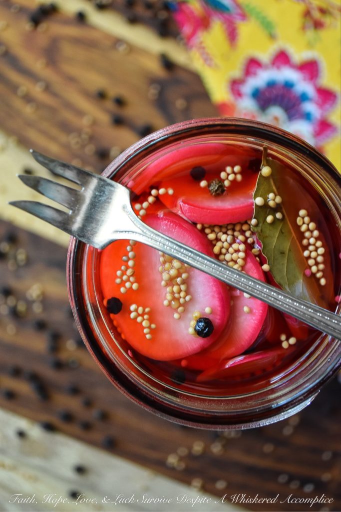 Quick Pickled Radishes with Black Peppercorns - These quick pickled radishes with black peppercorns are the perfect addition to tacos, barbecue, or just about any sandwich you can dream of. Each sliced radish is just a little bit sweet, slightly crunchy, and has an amazing amount of zing, which really works well when paired with other foods. The best part is, you can make these in almost no time at all. You're probably going to want to have a batch in your fridge at all times.