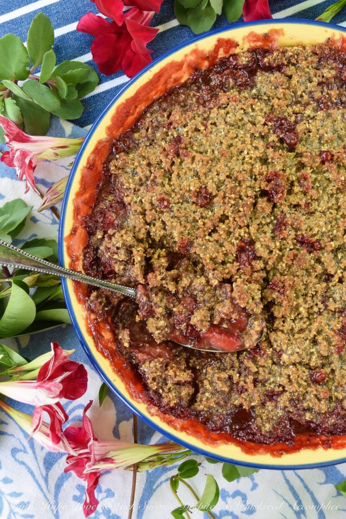 Strawberry Crisp with Pepita & Chia Seed Topping - It's often hard to achieve a truly crispy topping when baking a strawberry crisp if you aren't using nuts in the topping. This sweet summer strawberry crisp uses pepita and chia seeds to create the perfect crispy topping, for those who are allergic to nuts, who still crave a delicious crispy crunchy baked summer berry dessert.