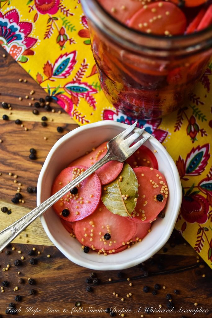 Quick Pickled Radishes with Black Peppercorns - These quick pickled radishes with black peppercorns are the perfect addition to tacos, barbecue, or just about any sandwich you can dream of. Each sliced radish is just a little bit sweet, slightly crunchy, and has an amazing amount of zing, which really works well when paired with other foods. The best part is, you can make these in almost no time at all. You're probably going to want to have a batch in your fridge at all times.