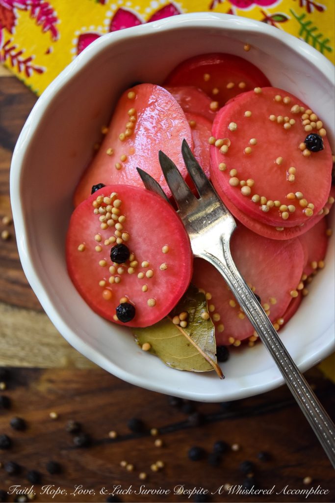 Quick Pickled Radishes with Black Peppercorns - These quick pickled radishes with black peppercorns are the perfect addition to tacos, barbecue, or just about any sandwich you can dream of. Each sliced radish is just a little bit sweet, slightly crunchy, and has an amazing amount of zing, which really works well when paired with other foods. The best part is, you can make these in almost no time at all. You're probably going to want to have a batch in your fridge at all times.