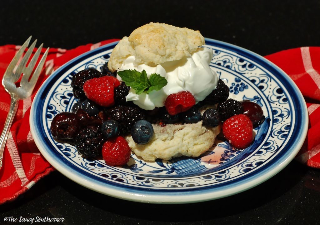 Drop Shortcakes with Limoncello Berries and Cream - The Saucy Southerner - July 2019 Recipe Round-Up - The Fourth of July is always an excellent day to fire up the grill and invite over some friends and family to observe the national holiday. This month we're sharing all of our favorite summer recipes to help you plan your picnic, cookout, or barbecue, including a few red, white, and blue patriotic ones, which are just perfect for celebrating July 4th.