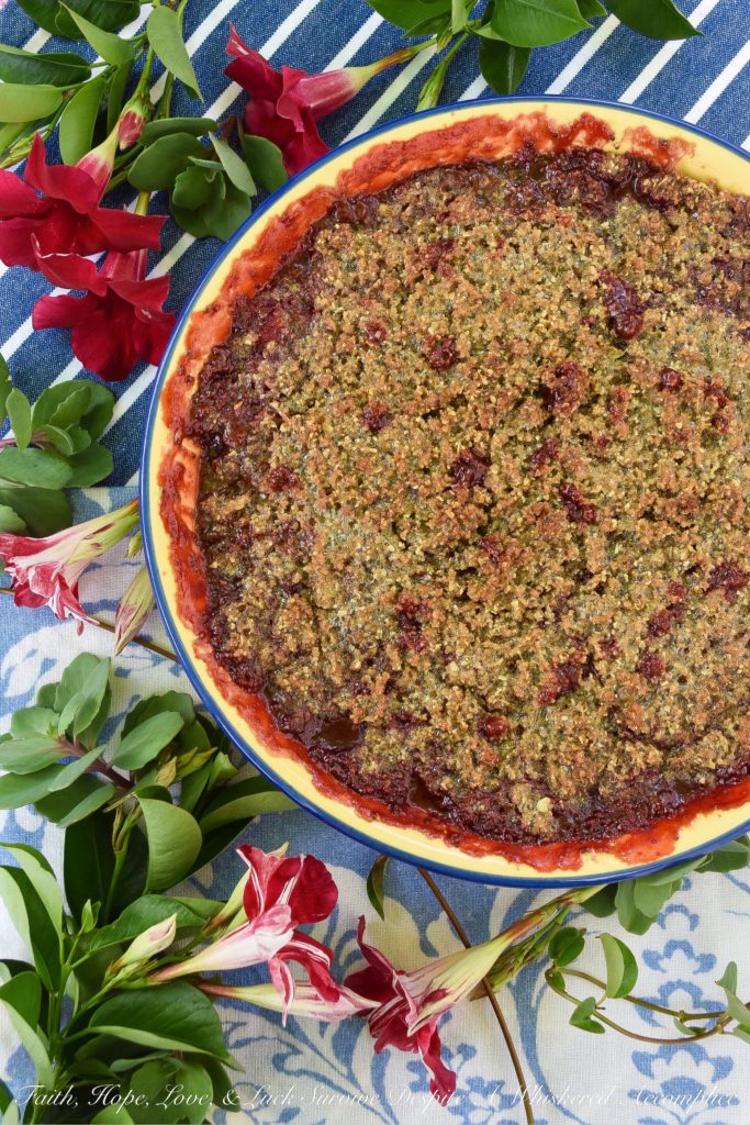 Strawberry Crisp with Pepita & Chia Seed Topping - It's often hard to achieve a truly crispy topping when baking a strawberry crisp if you aren't using nuts in the topping. This sweet summer strawberry crisp uses pepita and chia seeds to create the perfect crispy topping, for those who are allergic to nuts, who still crave a delicious crispy crunchy baked summer berry dessert.