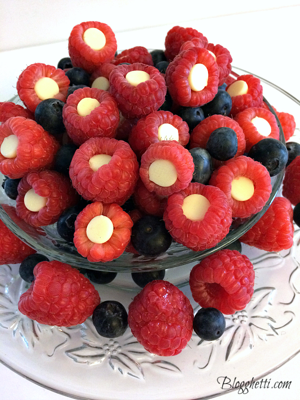 White Chocolate Stuffed Raspberries - Blogghetti - July 2019 Recipe Round-Up - The Fourth of July is always an excellent day to fire up the grill and invite over some friends and family to observe the national holiday. This month we're sharing all of our favorite summer recipes to help you plan your picnic, cookout, or barbecue, including a few red, white, and blue patriotic ones, which are just perfect for celebrating July 4th.