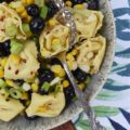 Tortellini Pasta Salad with Corn and Blueberries - I'm always looking for new side salads to bring along with me to cookouts, barbecues, and picnics, which can withstand the heat of summer. This healthy pasta salad made using frozen corn and refrigerated tortellini is the perfect example. It's tossed with fresh blueberries, chopped scallions, and a light olive oil vinaigrette, which makes this a delicious and easy to make pasta salad just right for a hot summer's day.