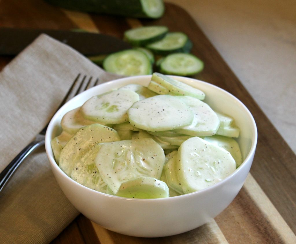 Creamy Cucumber Salad - Cheese Curd in Paradise - Summer will be over before you know it. So, while the weather is still hot, get out and enjoy it as much as you can. We're helping you by sharing all our favorite picnic and cookout recipes. Hopefully, they'll inspire you to spend time with friends in the sun and enjoy the warm summer weather while it lasts.